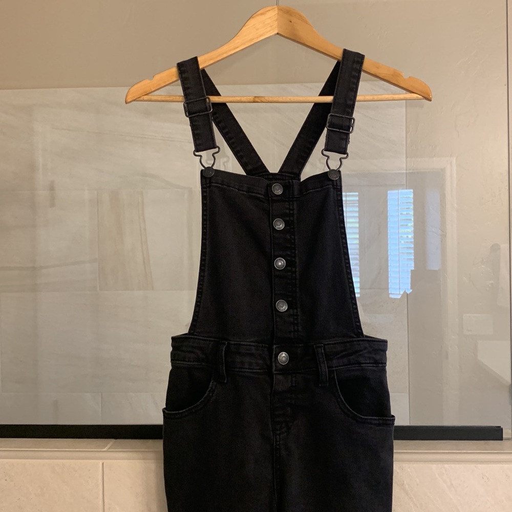 Cat & Jack girls overalls, size Large 10/12. The color is a black charcoal grey.